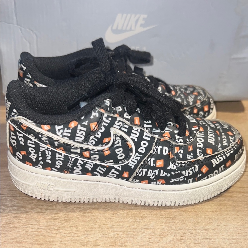 Nike Black Air Force  and White 'Just Do It' Sneakers with Orange Accents